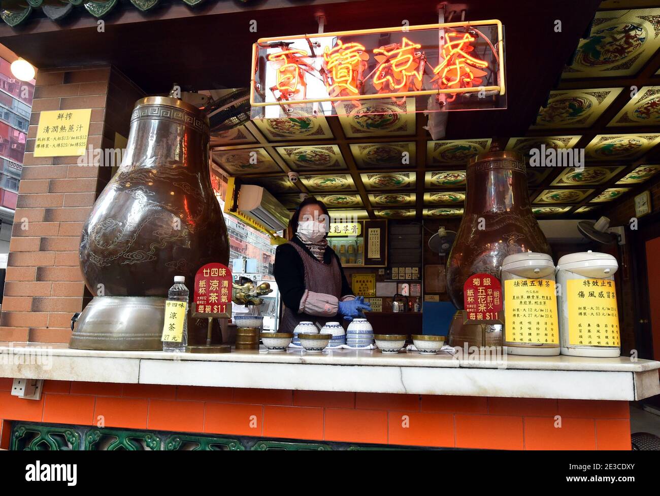 Hong Kong. 18th Jan, 2021. A staff member is seen at a herbal tea shop in south China's Hong Kong, Jan. 18, 2021. Hong Kong's Center for Health Protection (CHP) reported 107 additional confirmed cases of COVID-19 on Monday, a new high in about one month. The new cases included 102 local infections and five imported ones, taking its total tally to 9,664. More than 40 of the new local cases were untraceable and there were about 50 cases tested positive preliminarily, according to a CHP press briefing. Credit: Lo Ping Fai/Xinhua/Alamy Live News Stock Photo