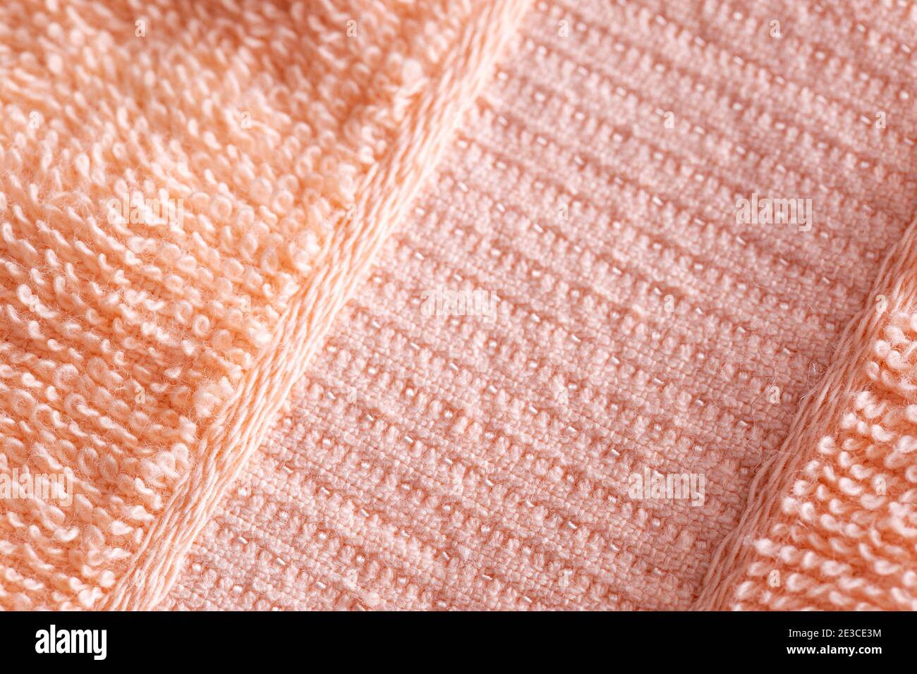 Soft peach-colored fleecy fabric. Orange fabric background Stock Photo