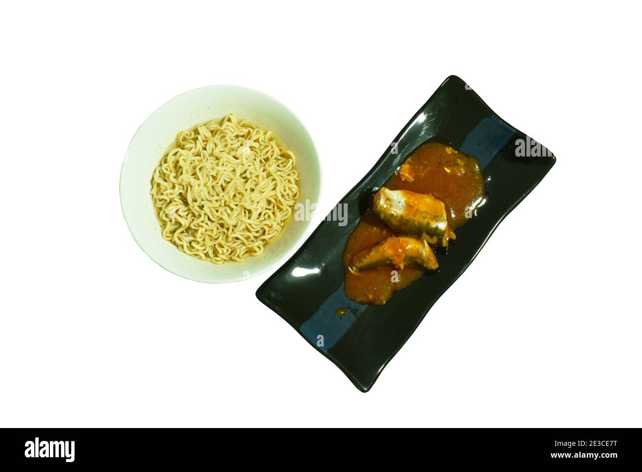 soft boiled instant noodles and fish can with tomato sauce on white