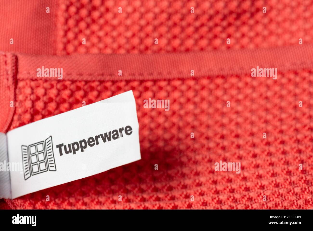 Tupperware label logo sign on microfiber cleaning cloth. Tupperware Brands home products. Stock Photo