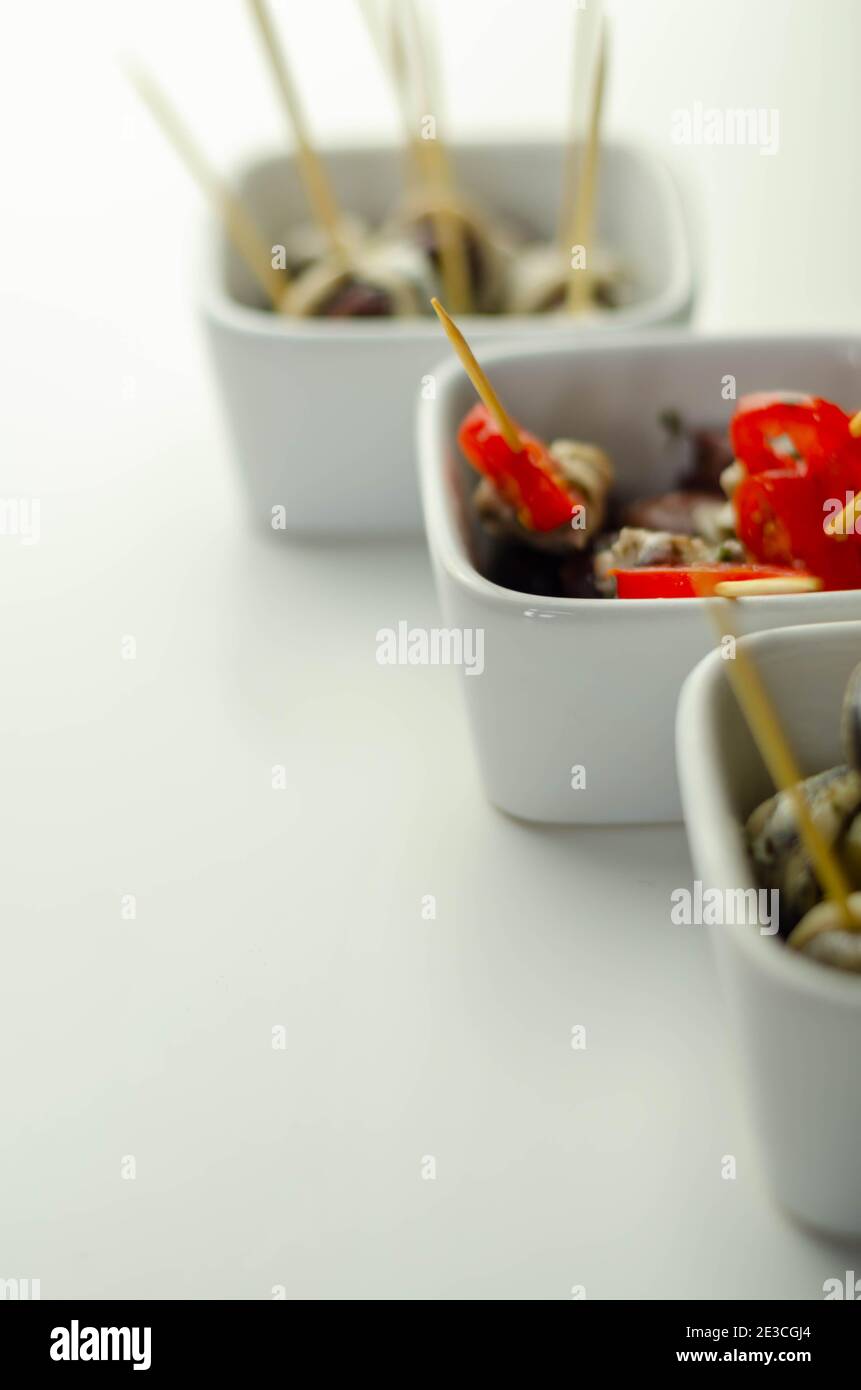 The traditional Spanish appetizers of olives, tomatoes and anchovies in