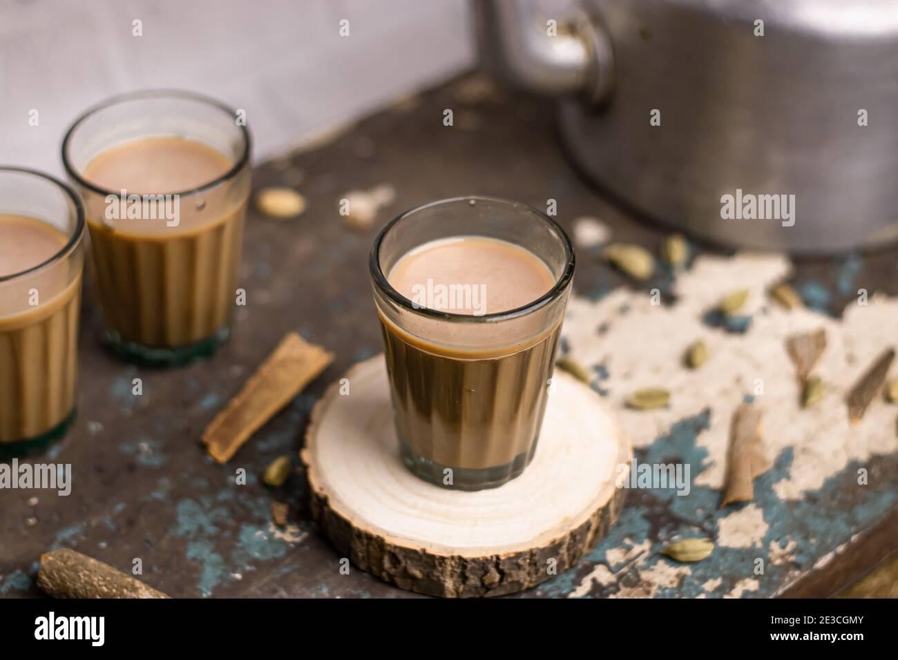 Indian chai in glass cups with metal kettle and other masalas to make the  tea Stock Photo - Alamy