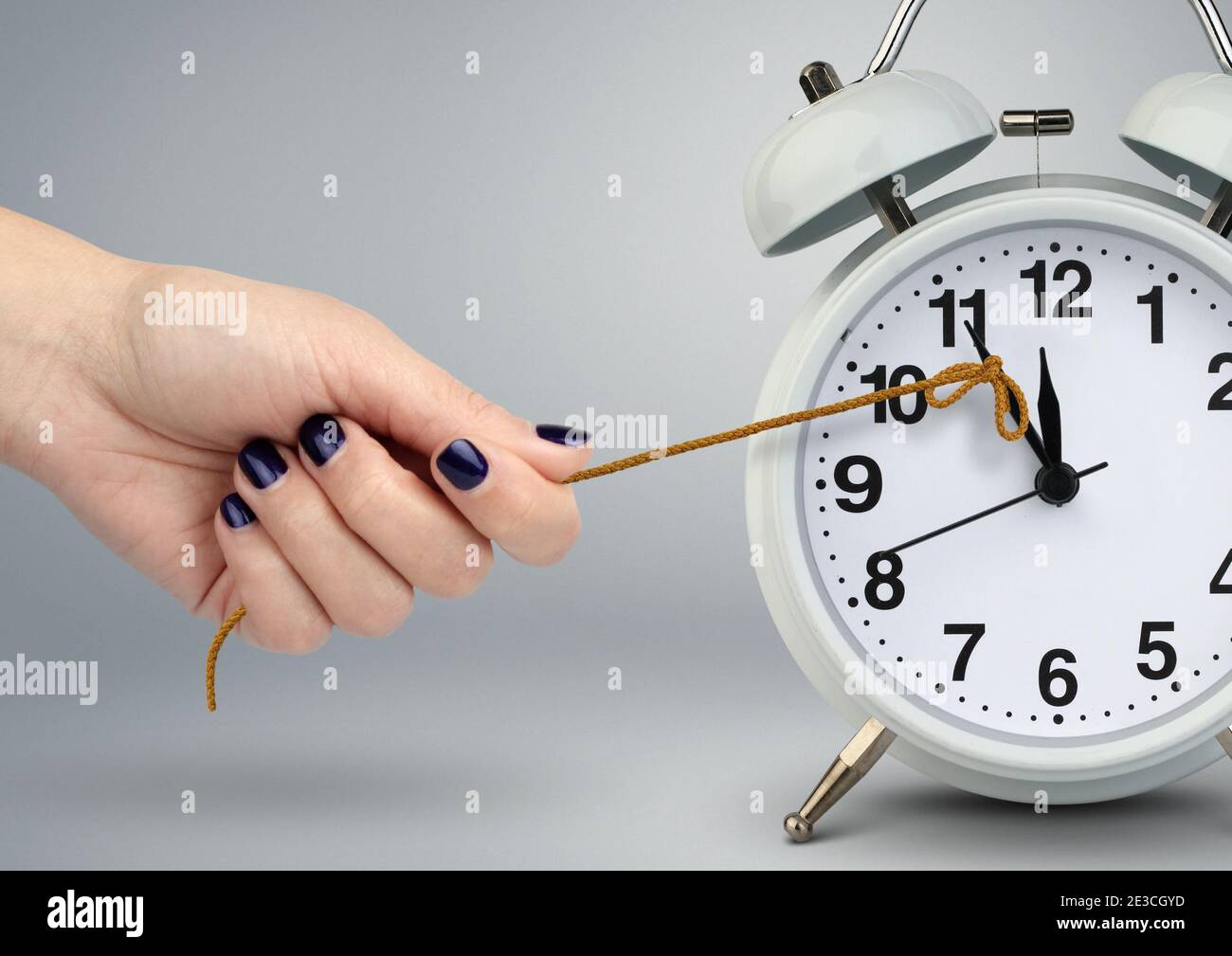 delay concept, time on clock stop by hand Stock Photo
