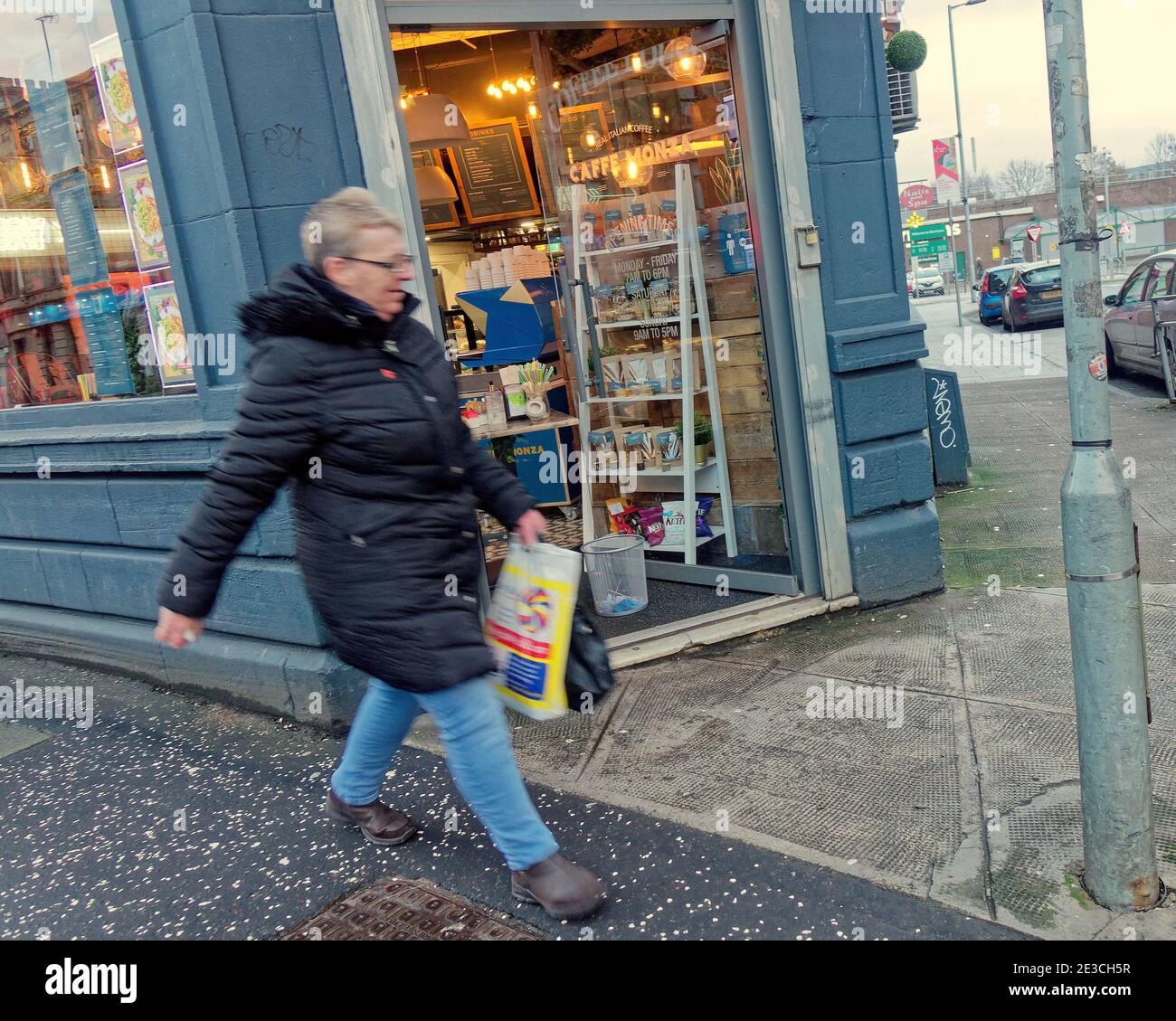 Glasgow, Scotland, UK. 18th January, 2021.Lockdown Monday saw sparsely filled streets with  people walking around lost with the new take-away rules nothing to do. Credit: The cafe at partick bus station was only taking orders through a hatchway made from its door.  Gerard Ferry/Alamy Live News Stock Photo