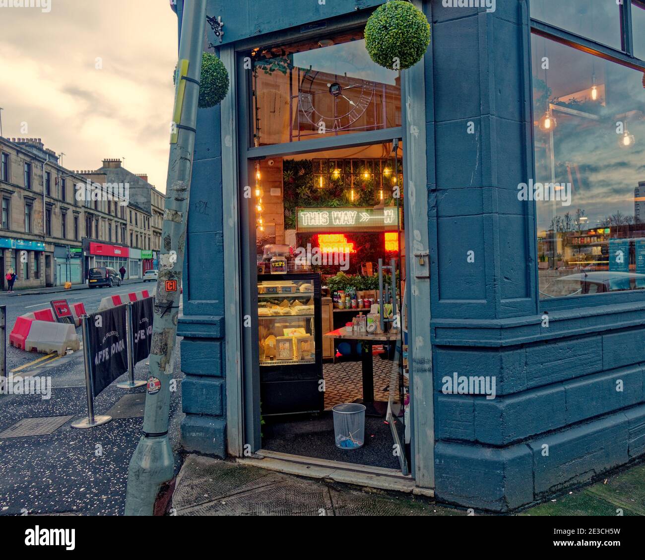 Glasgow, Scotland, UK. 18th January, 2021.Lockdown Monday saw sparsely filled streets with  people walking around lost with the new take-away rules nothing to do. Credit: The cafe at partick bus station was only taking orders through a hatchway made from its door.  Gerard Ferry/Alamy Live News Stock Photo