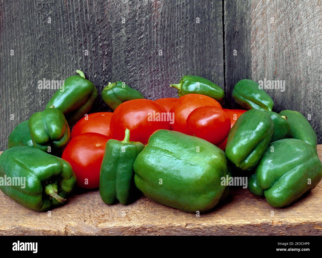 A rustic still life of Red & Green Peppers Stock Photo