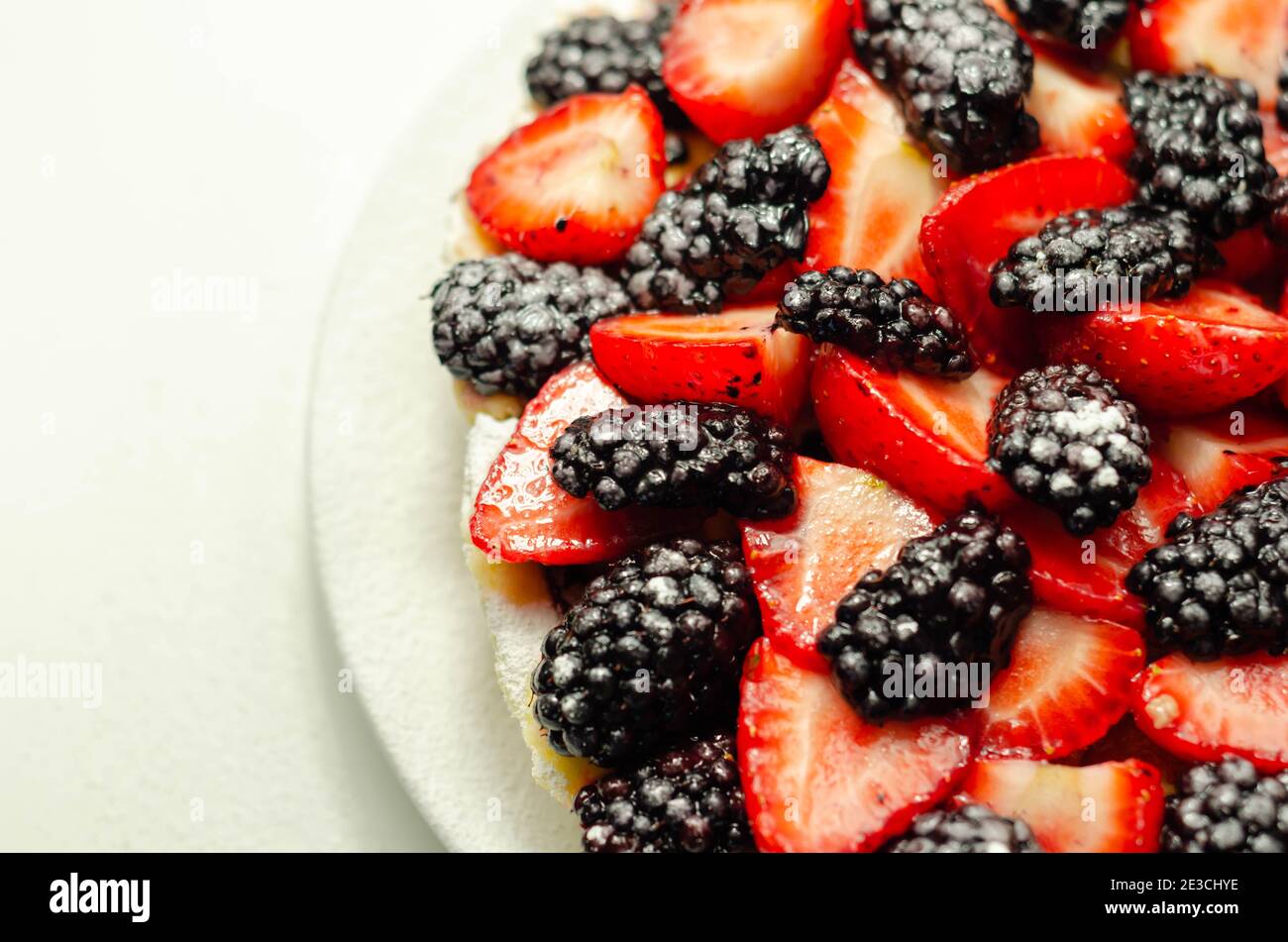 Butter enriched shortcrust pastry topped strawberries and blackberries