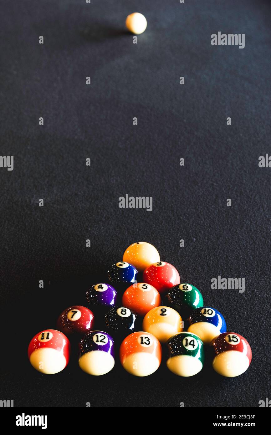 Some pool balls arranged just before the break.  This image was meant as homage to Rush's 2112 album cover as Neil Peart passed away the day before. Stock Photo