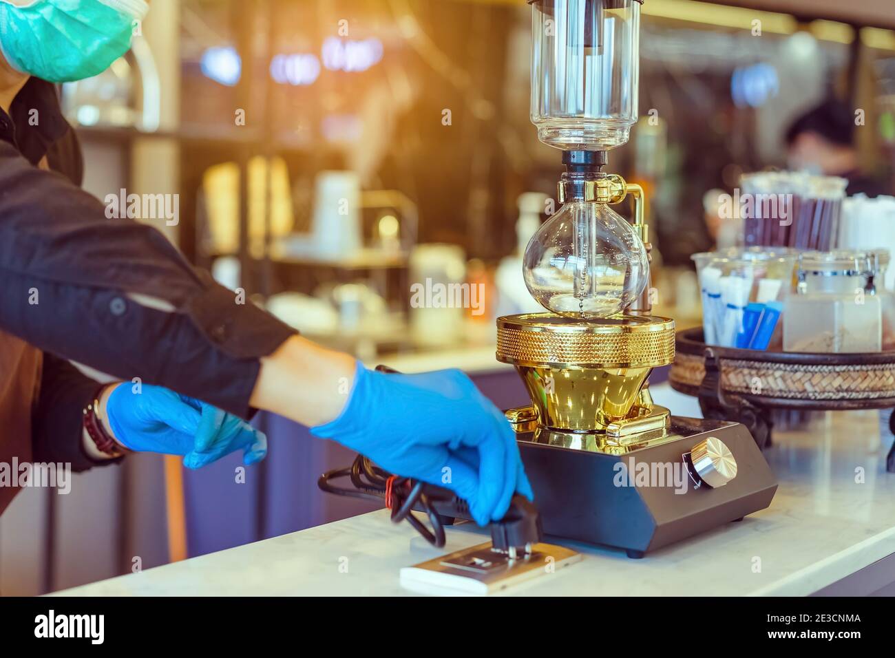 Syphon (Siphon) coffee maker brews drink using two chambers where vapor