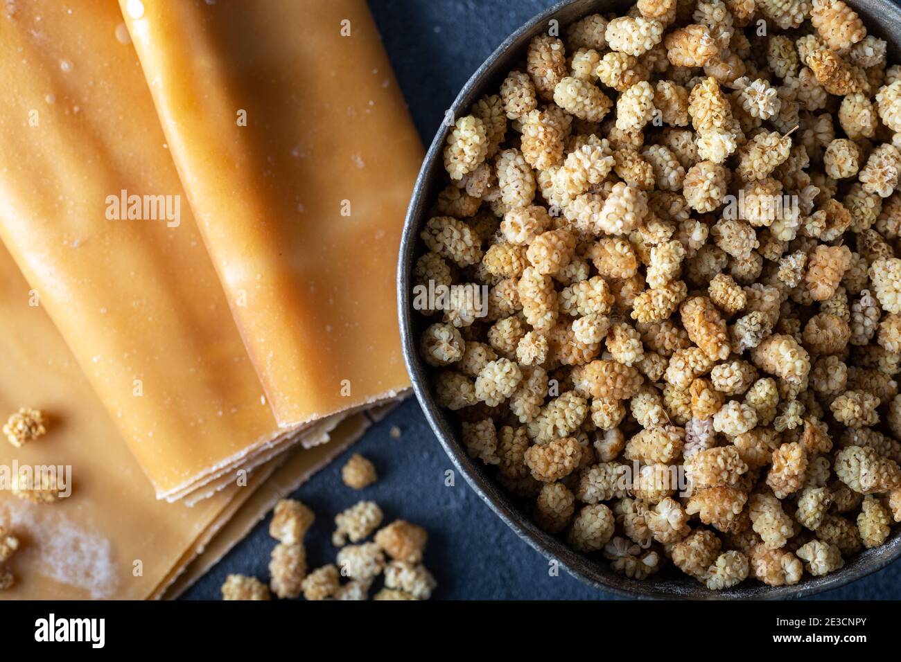 Mulberry pulp (pestil) with dried mulberries.  Dried Fruit Pulp Mulberry. Stock Photo