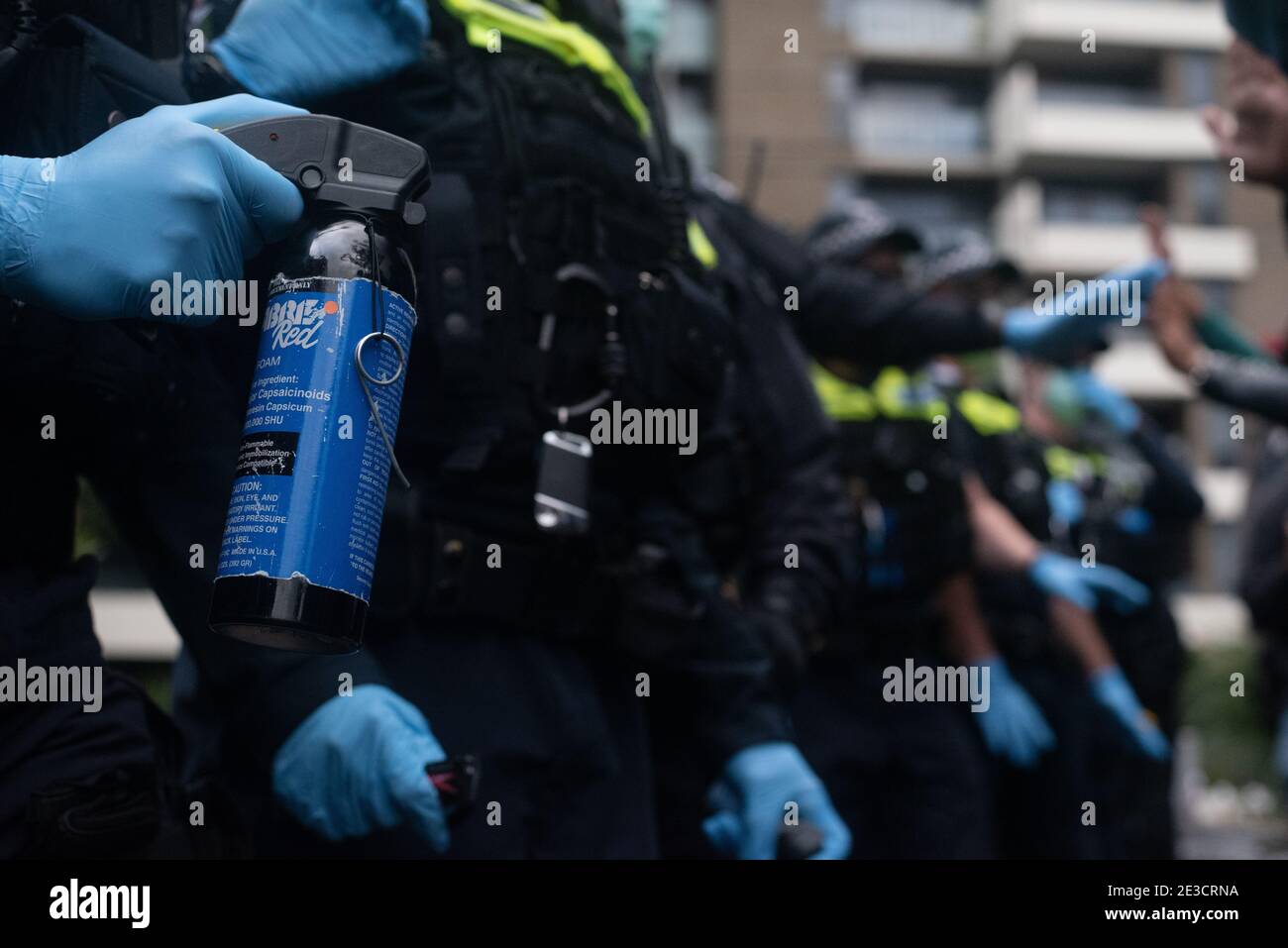 Melbourne, Victoria. 16 January 2021. Free the Refugees Block Party. Police pull out the pepper spray at a peaceful protest. Jay Kogler/Alamy Live News Stock Photo