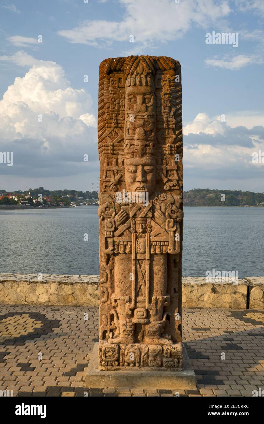 Flores, Guatemala, Central America: a stela representing a Mayan ruler in antique style in the evening sun Stock Photo