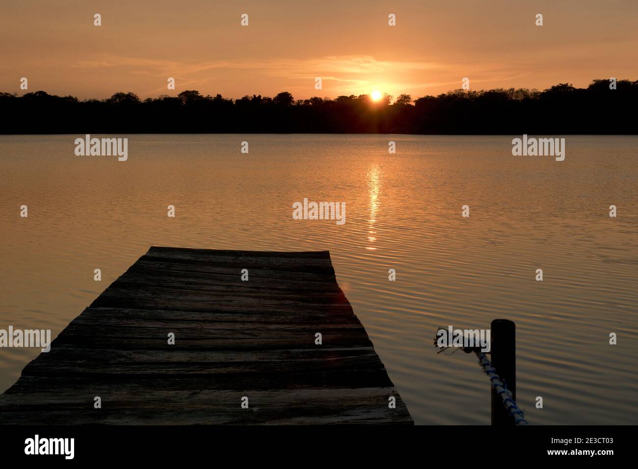 Flores, Guatemala, Central America: sunset at lake with jetty near Flores Stock Photo