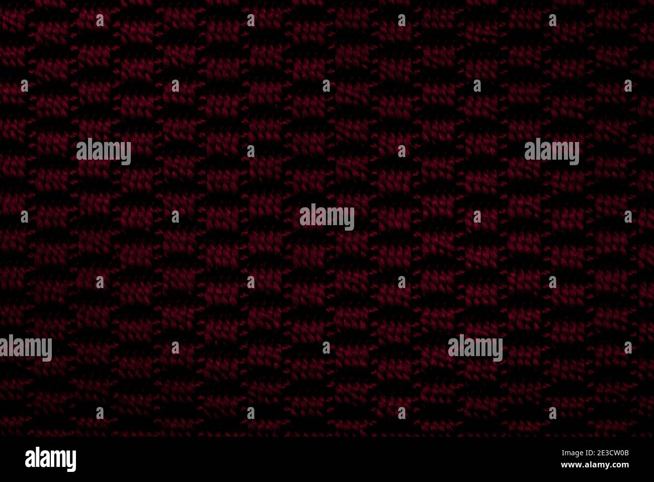 Dark red knitted fabric background texture Stock Photo