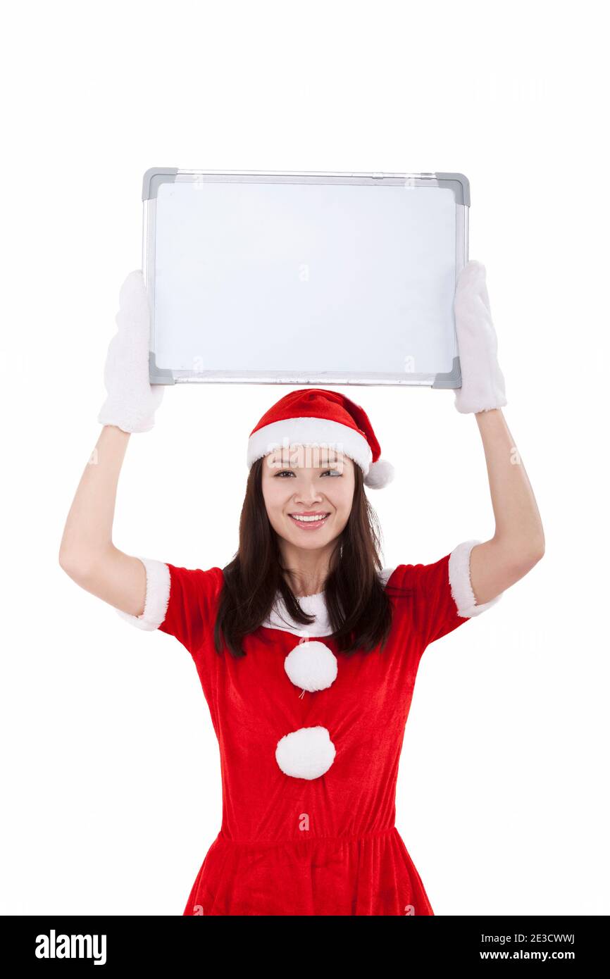 Three young women wearing santa hi-res stock photography and images - Alamy