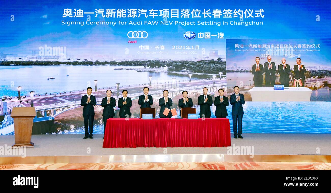 (210118) -- CHANGCHUN, Jan. 18, 2021 (Xinhua) -- Photo taken on Jan. 18, 2021 shows representatives of China's leading automaker First Automotive Works (FAW), German automaker Audi, and the Changchun government signing an agreement to launch a project to produce electric vehicles in Changchun, northeast China's Jilin Province. The three sides signed an agreement via video on Monday. The project plans to introduce the Premium Platform Electric (PPE). The first factory will invest more than 30 billion yuan (4.62 billion U.S. dollars) under the project. The first car model will go into produc Stock Photo