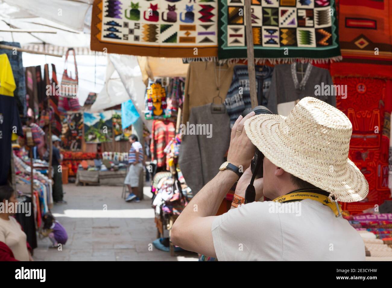 Pisac PeruTourist snaps a photo at Pisac Market Stock Photo