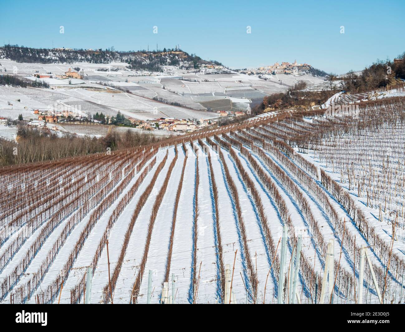 Italy Piedmont: Barolo wine yards unique landscape winter snow, La Morra medieval village castle on hill top, italian historical heritage grape agricu Stock Photo