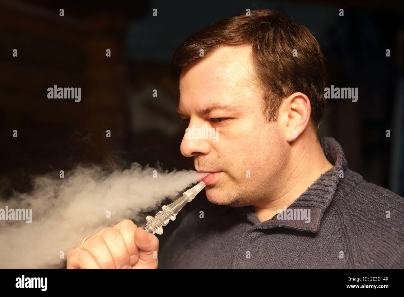 Man smoking hookah in the outdoor cafe Stock Photo Alamy
