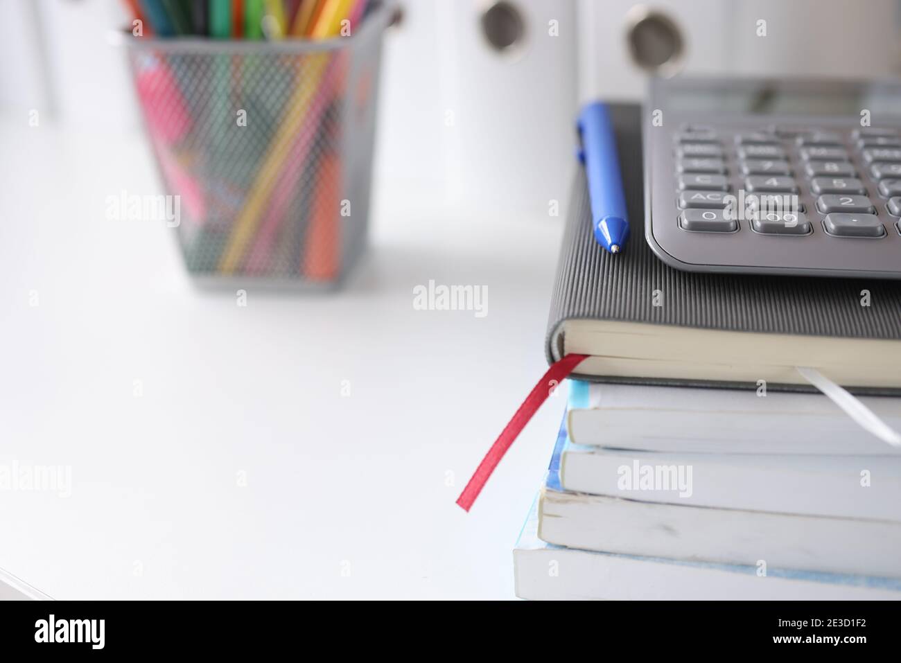 On table are documents diary with a calculator, pencils next to it Stock Photo