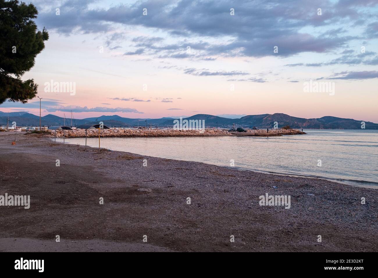 Tolo, Peloponesse, Greece - January 06, 2019: Sunset on the beach Stock Photo