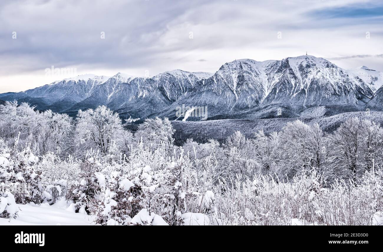 Winter landscape with mountain peaks covered in snow. Beautiful view ...