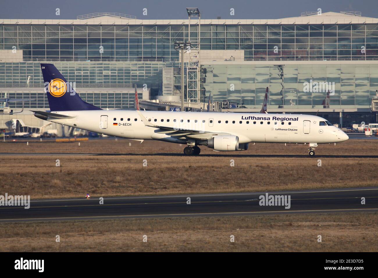 German Lufthansa Regional Embraer 190 with registration D-AECH on taxiway at Frankfurt Airport. Stock Photo