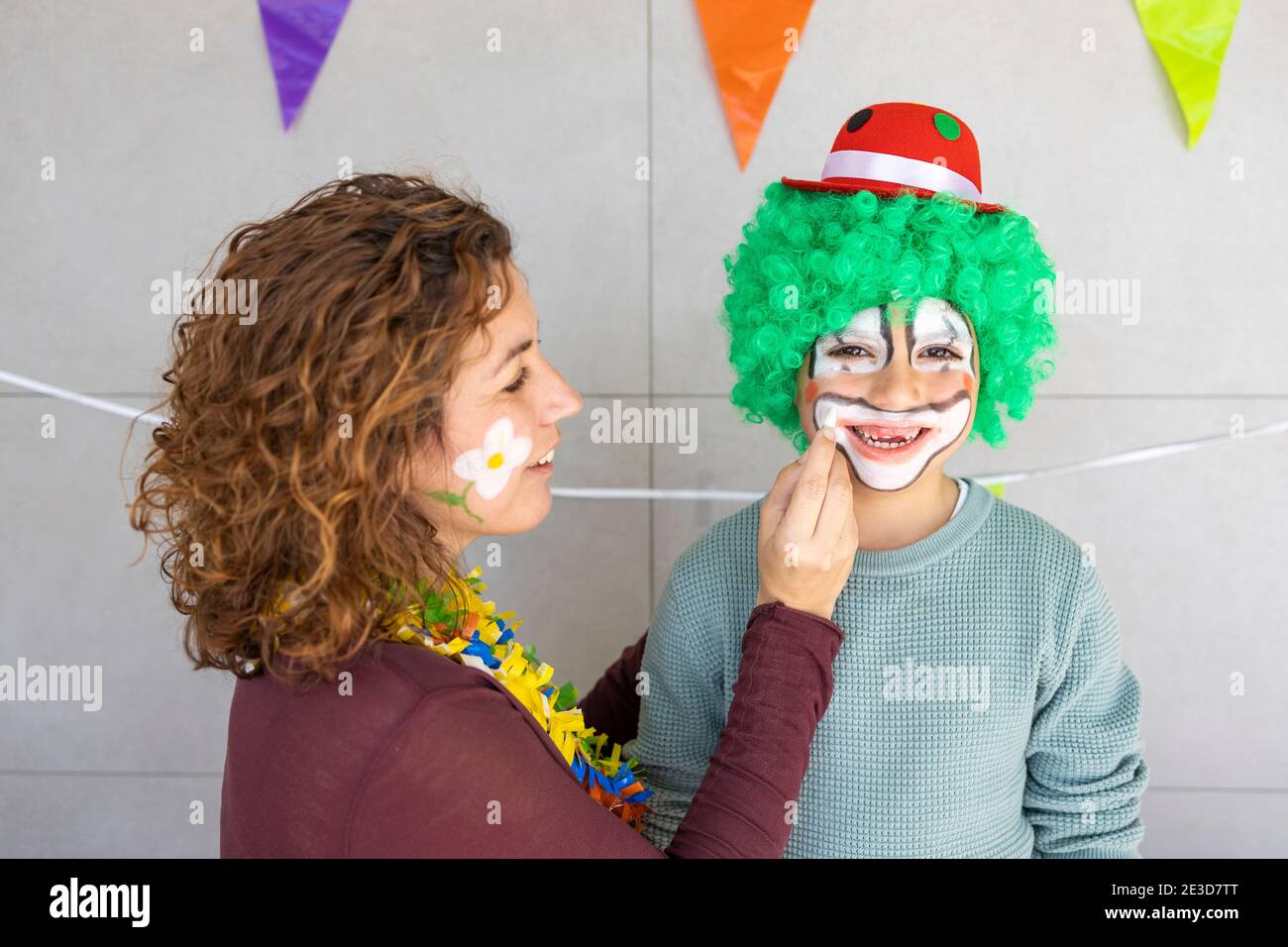 young woman with body painting on her face, ugly scary clown, Halloween  topic Stock Photo - Alamy