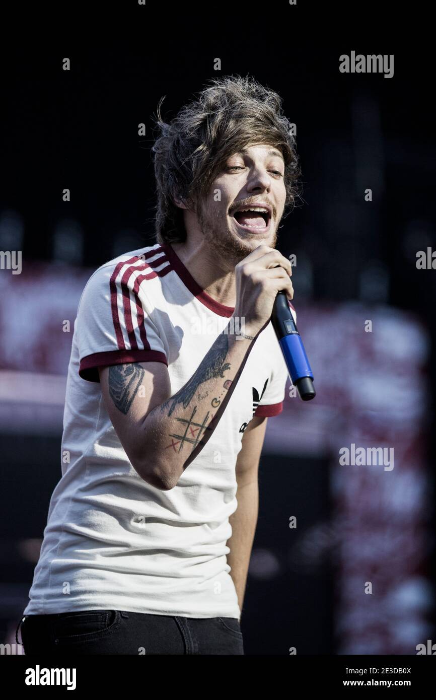 Copenhagen, Denmark. 16th, June 2014. The popular boy band One Direction  performs a live concert at Parken in Copenhagen. Here singer Louis Tomlinson  is seen live on stage. (Photo credit: Gonzales Photo -, image size:866x1390