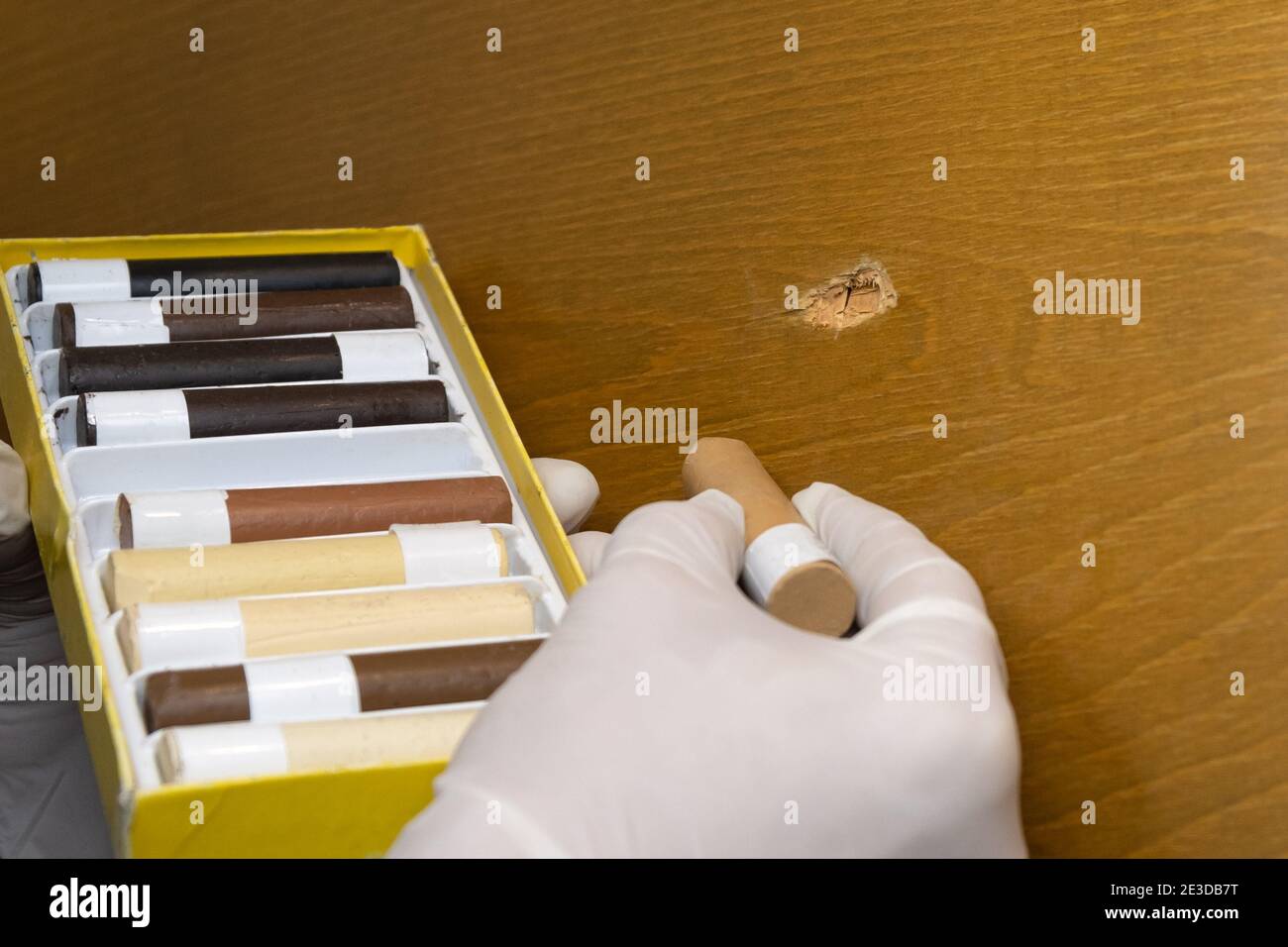 restoration of furniture and wooden surfaces, master selects the color