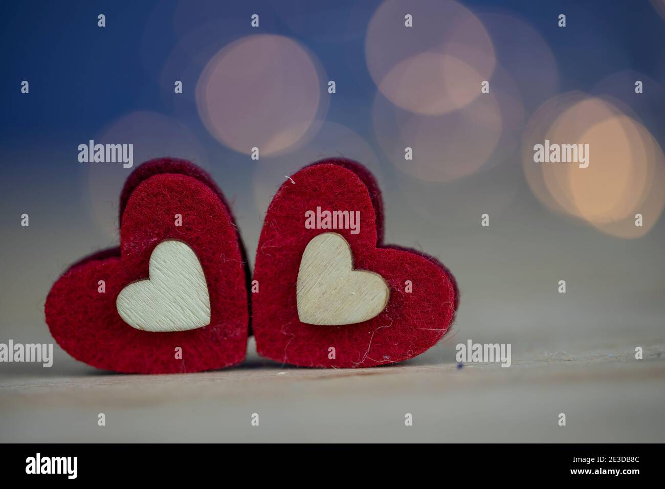 Valentines day background with two red hearts Stock Photo - Alamy