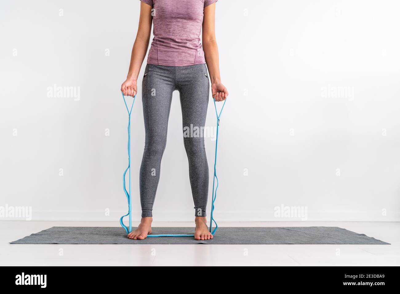 Resistance band fitness at home woman training with strap with loops