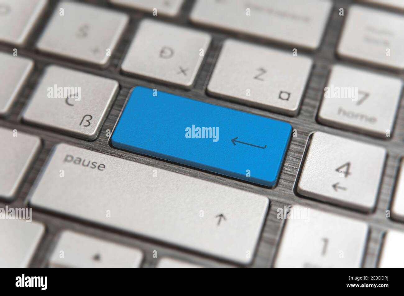 Keyboard with blue blank Enter button modern pc text communication board Stock Photo