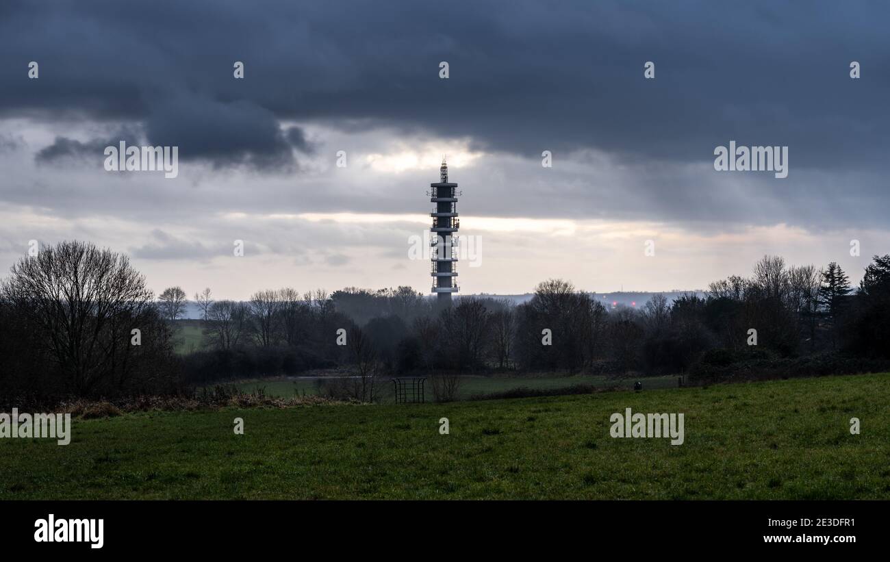 A rain storm passes over the Purdown Transmitter tower in Stoke Park in the north of Bristol. Stock Photo
