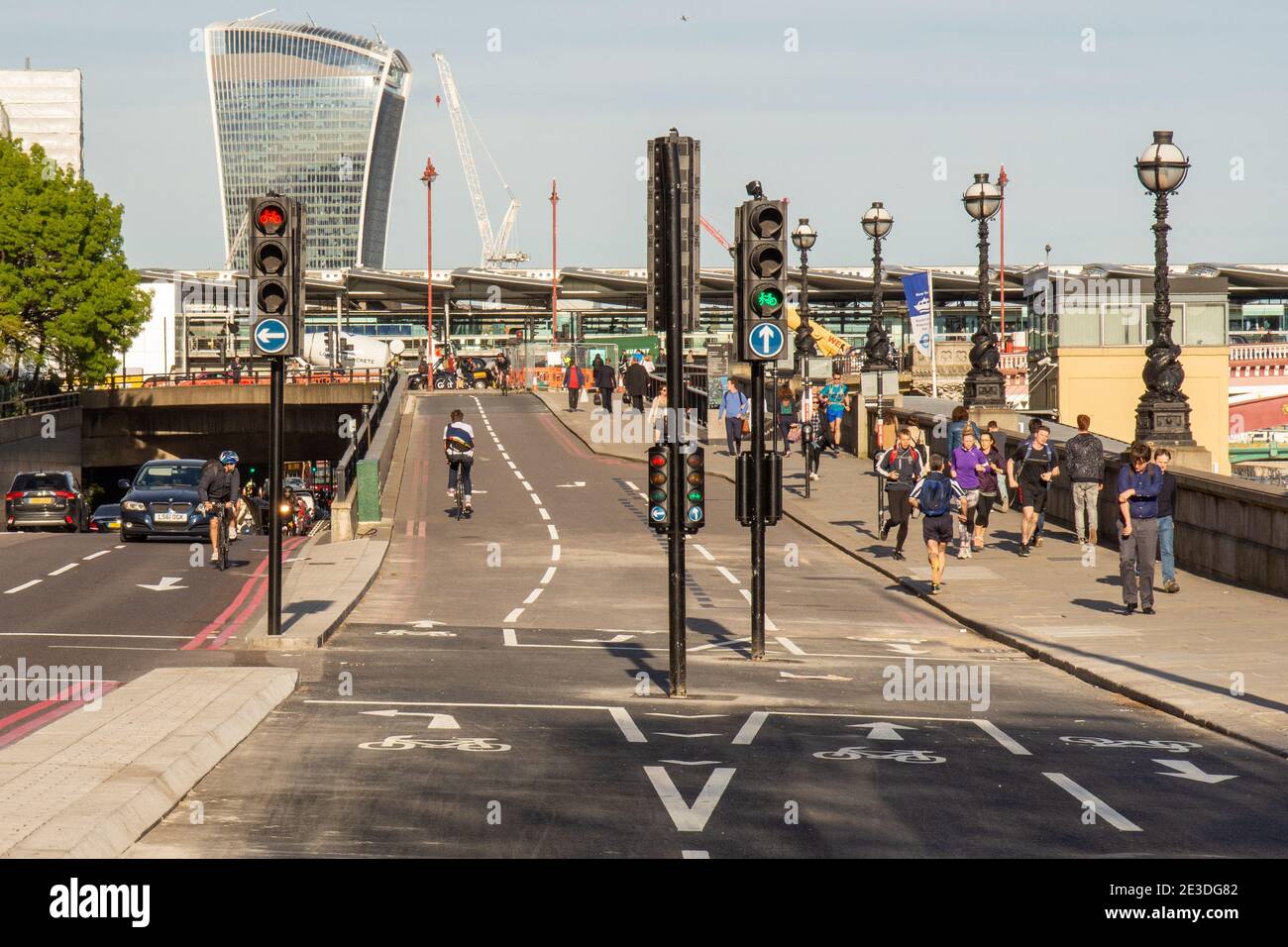 Cyclists try out a nearly completed section of the new Cycle Superhighway 3 on London's Embankment, featuring cycle tracks separated from motor traffi Stock Photo