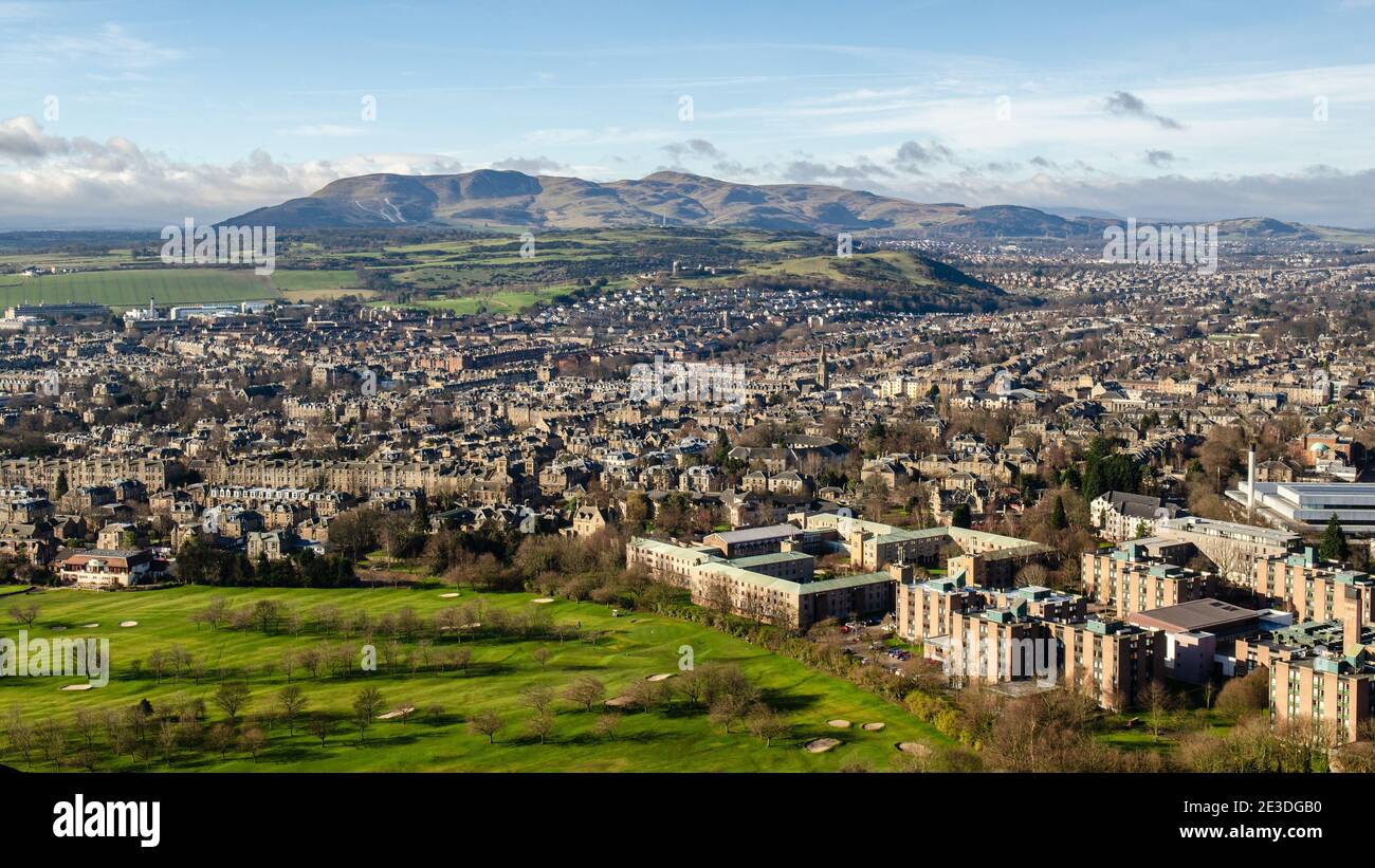 Sun shines on the Newington and Mayfield neighbourhoods of Edinburgh, and the Penland Hills beyond, as viewed from Arthur's Seat. Stock Photo