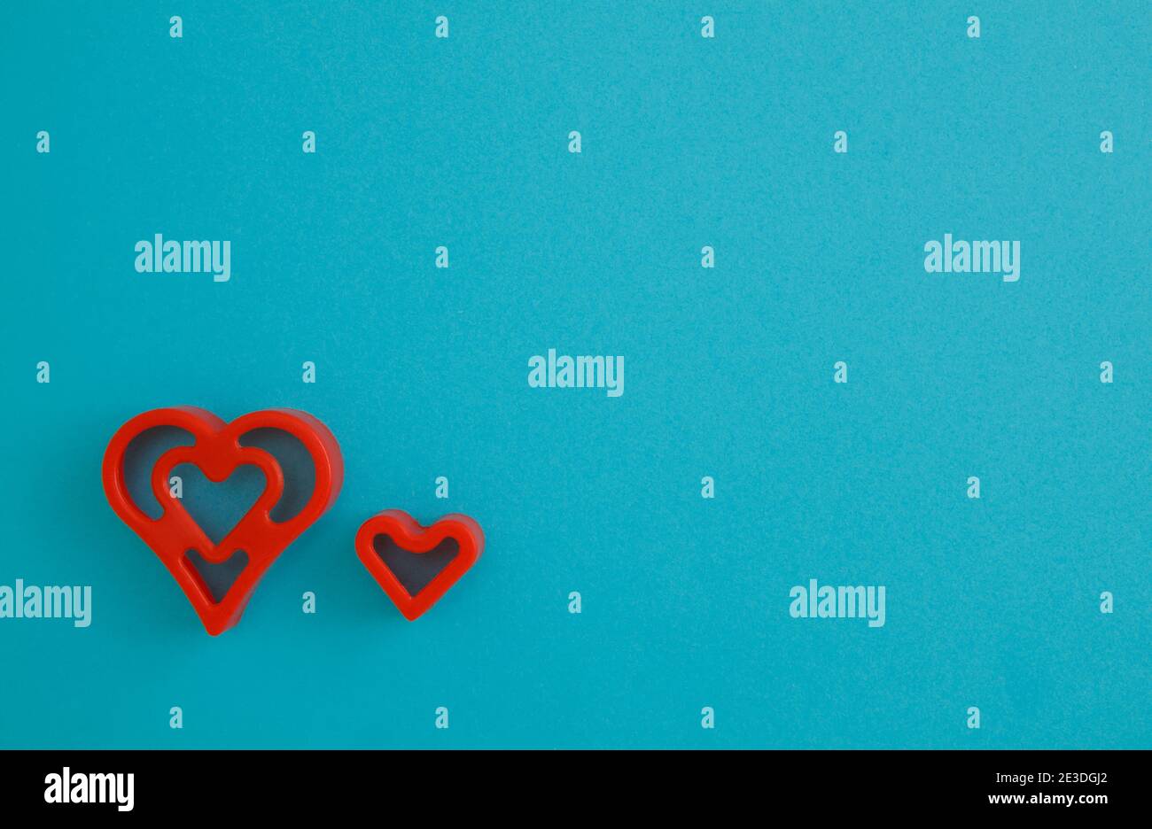 Red heart on blue background romantic colorful pattern, copy space for text. Stock Photo