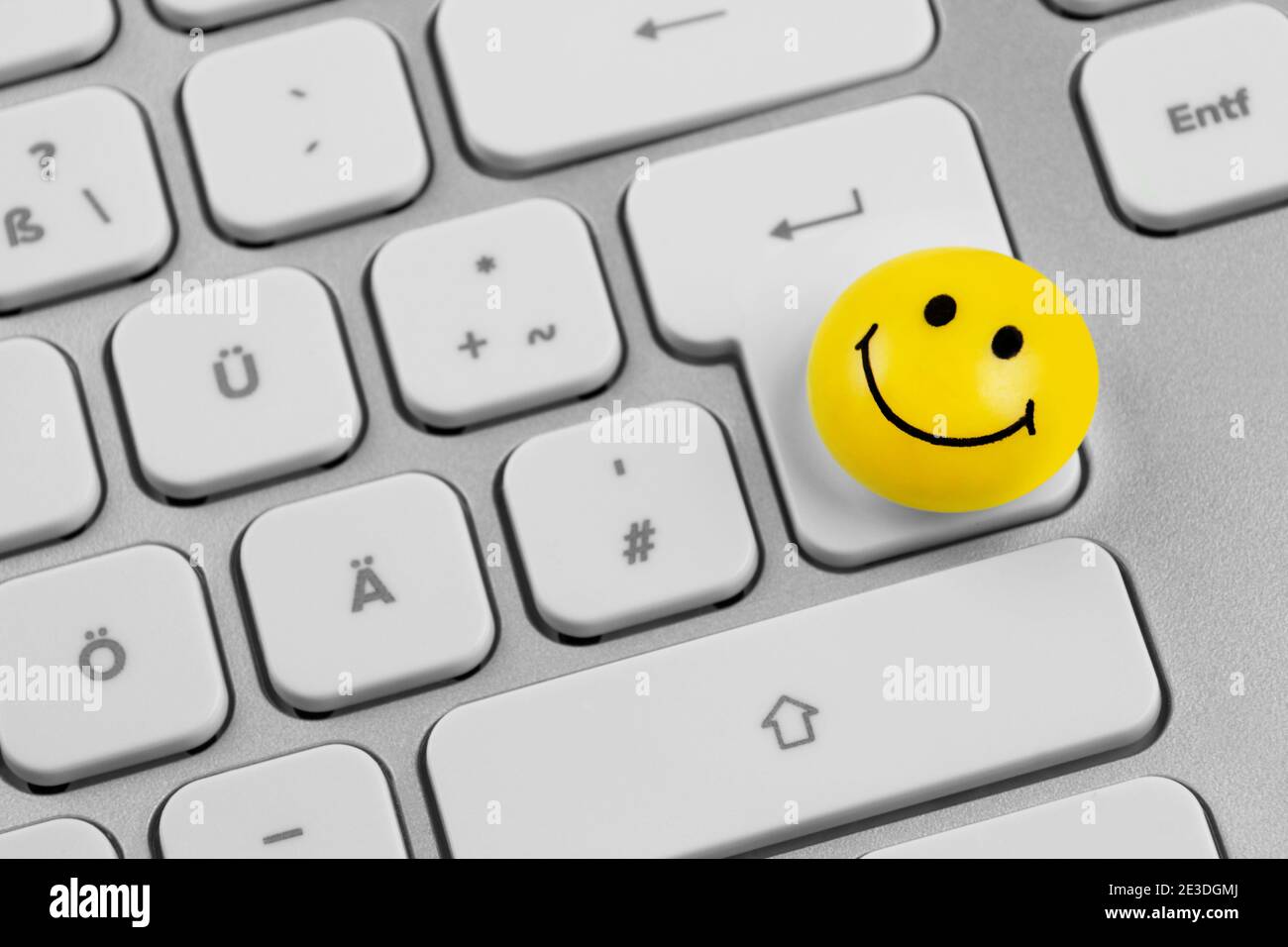 Yellow Smiley symbol and keyboard close up Stock Photo
