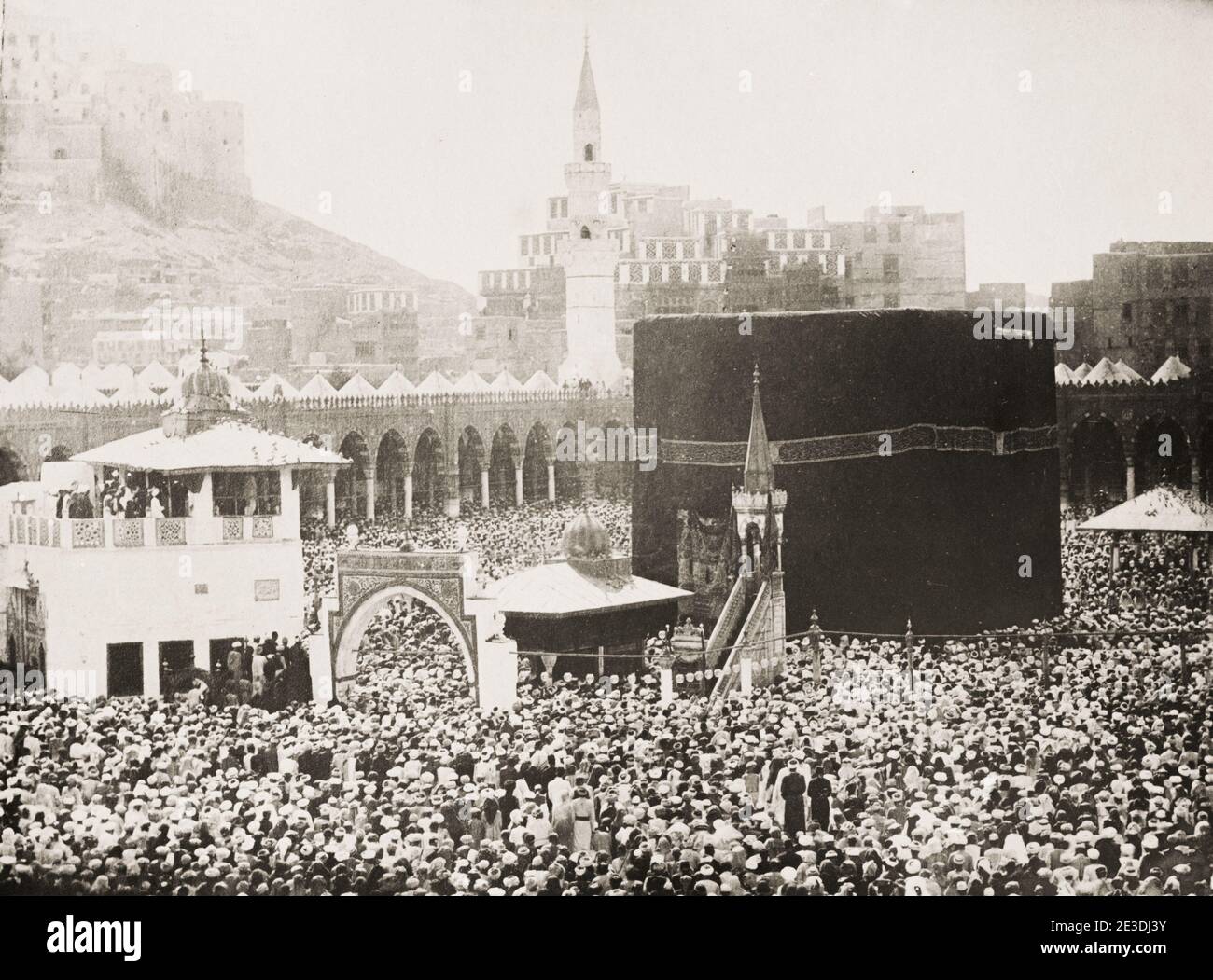 Vintage 19th century photograph: large crowd at the Kabaa, Mecca. The Kaaba, also spelled Ka'bah or Kabah, sometimes referred to as al-Kaʿbah al-Musharrafah, is a building at the center of Islam's most important mosque, the Masjid al-Haram in Mecca, Saudi Arabia. It is the most sacred site in Islam. Stock Photo