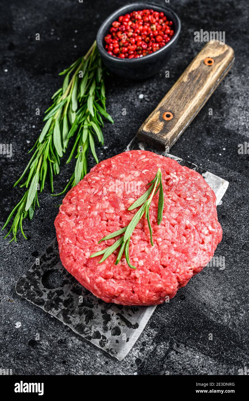 Burger Patty, ground beef meat. Black background. Top view Stock Photo Alamy