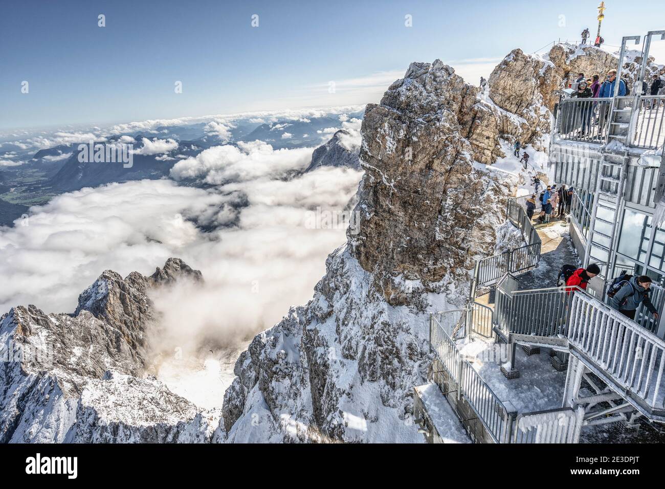 Zugspitze, Germany - Aug 5, 2020: Tourists at observation tower on Snowy Zugspitze Stock Photo