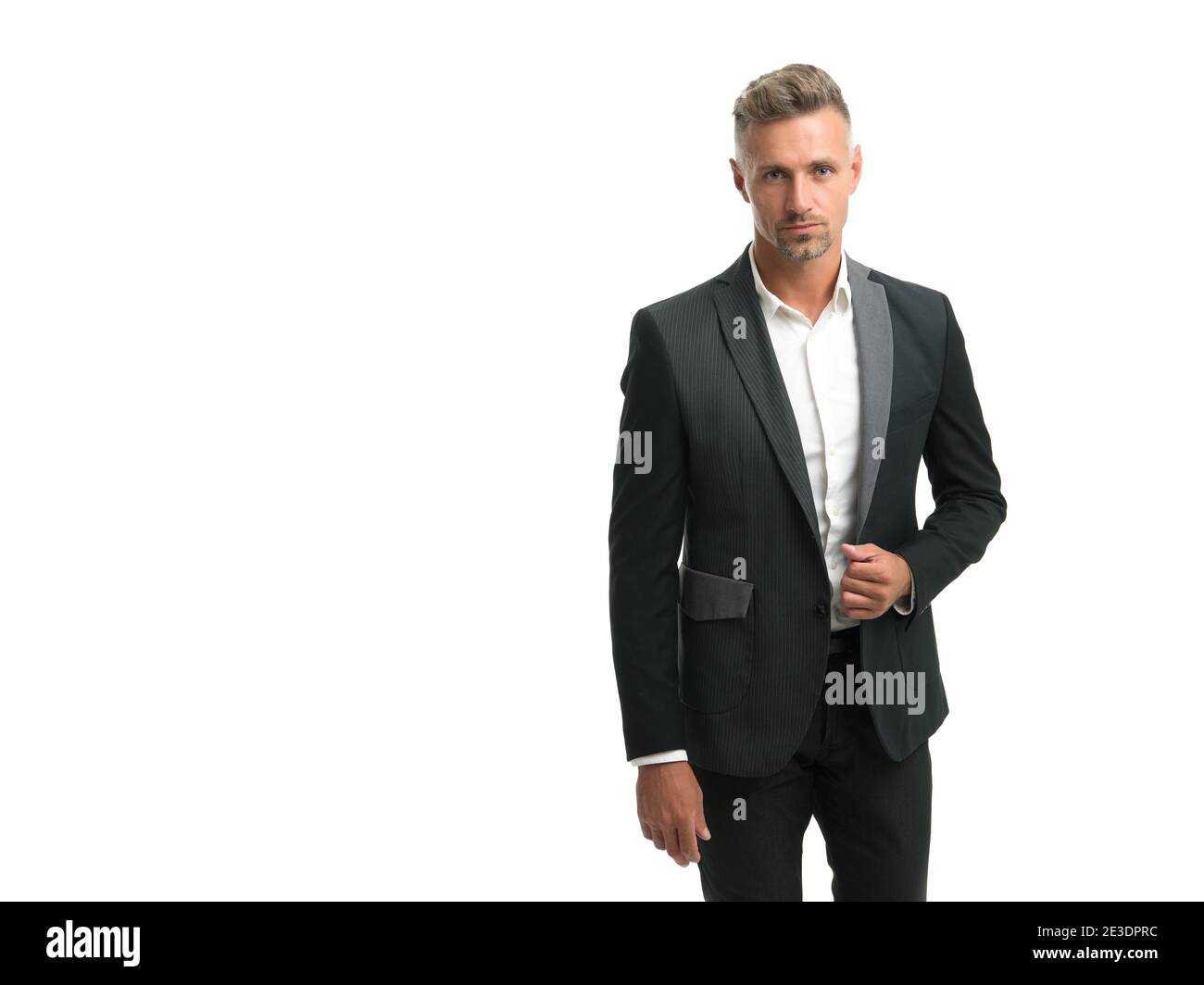 Handsome mature man wear elegant tailored suit in formal business style with fashion look isolated on white, bespoke, copy space. Stock Photo