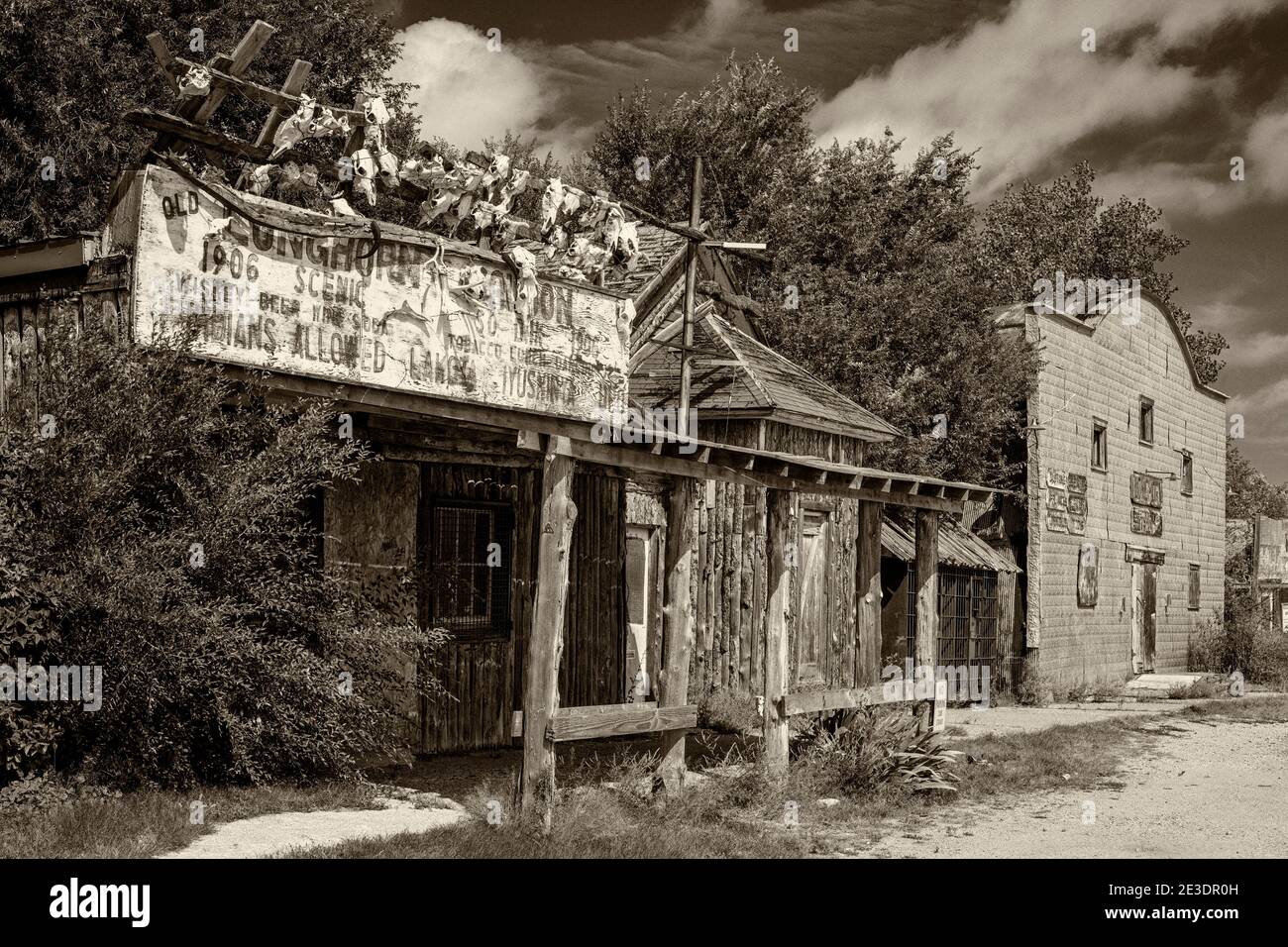 The rustic Longhorn Saloon and Store in Scenic, SD, with the courthouse