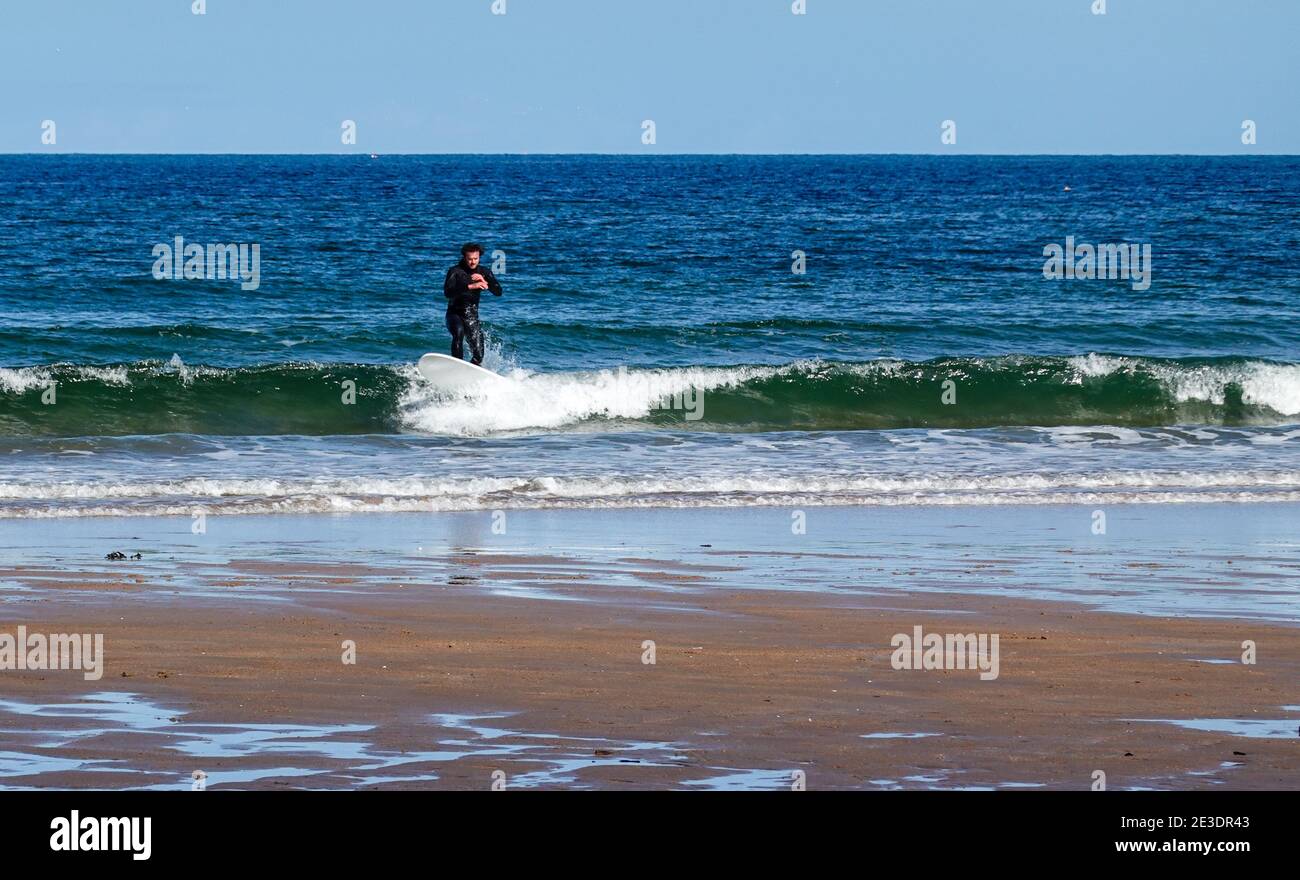 Surfers on Belhaven Beach, near Dunbar, East Lothian Stock Photo