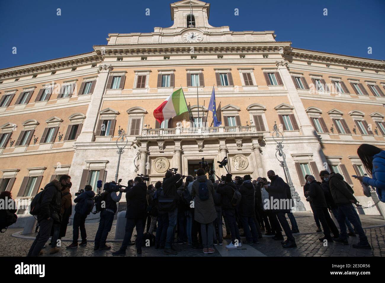 Rome Italy , January 18th 2021 Journalists gathered outside the Italian Chamber of Deputies.  Rome, 18/01/2021. Italian Members of Parliament outside the Chamber of Deputies (Italian Parliament lower house) while the Italian Prime Minister, Giuseppe Conte, asks the Chamber a vote of confidence to save the Italian Government after the defection of the two Cabinet ministers belonging to the tiny party, Italia Viva (Italy Alive), led by former Italian Prime Minister Matteo Renzi. Stock Photo