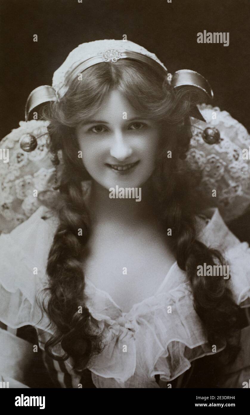 The notable Edwardian English actress and singer Nina Sevening (1885–1958), taken from a photographic postcard from the era. Stock Photo