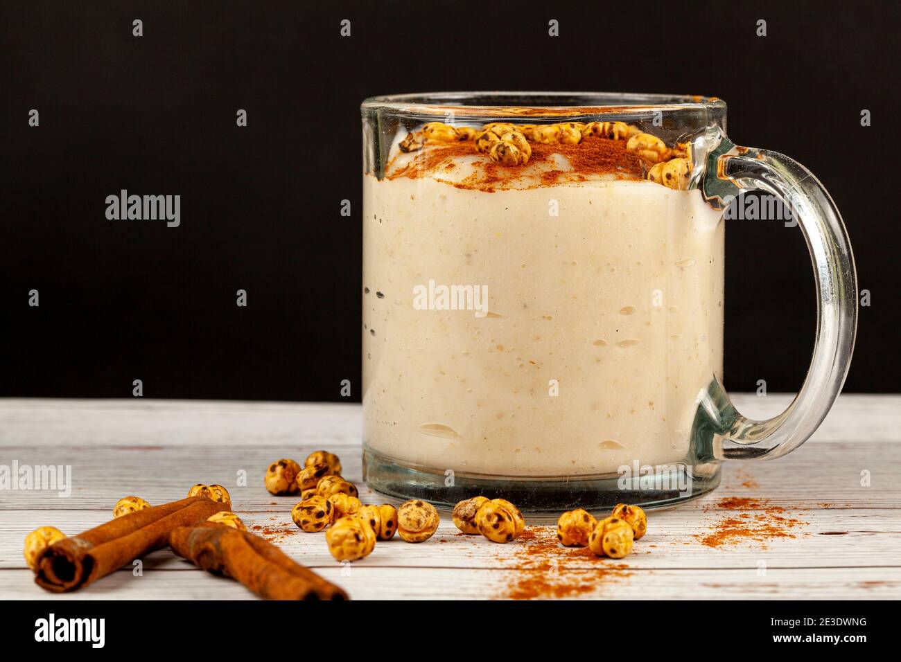 Traditional Turkish Boza, a fermented wheat and corn based drink popular in middle eastern countries in winter season. It is served with cinnamon and Stock Photo