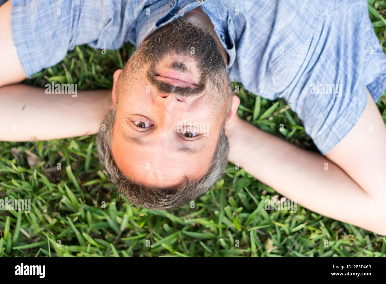 Young man upside down hi-res stock photography and images - Alamy