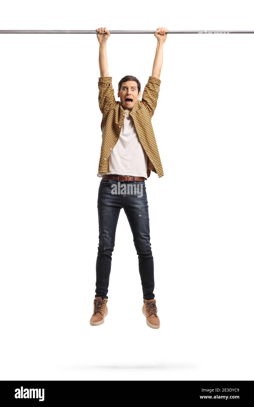 Young man hanging from a metal bar isolated on white background Stock