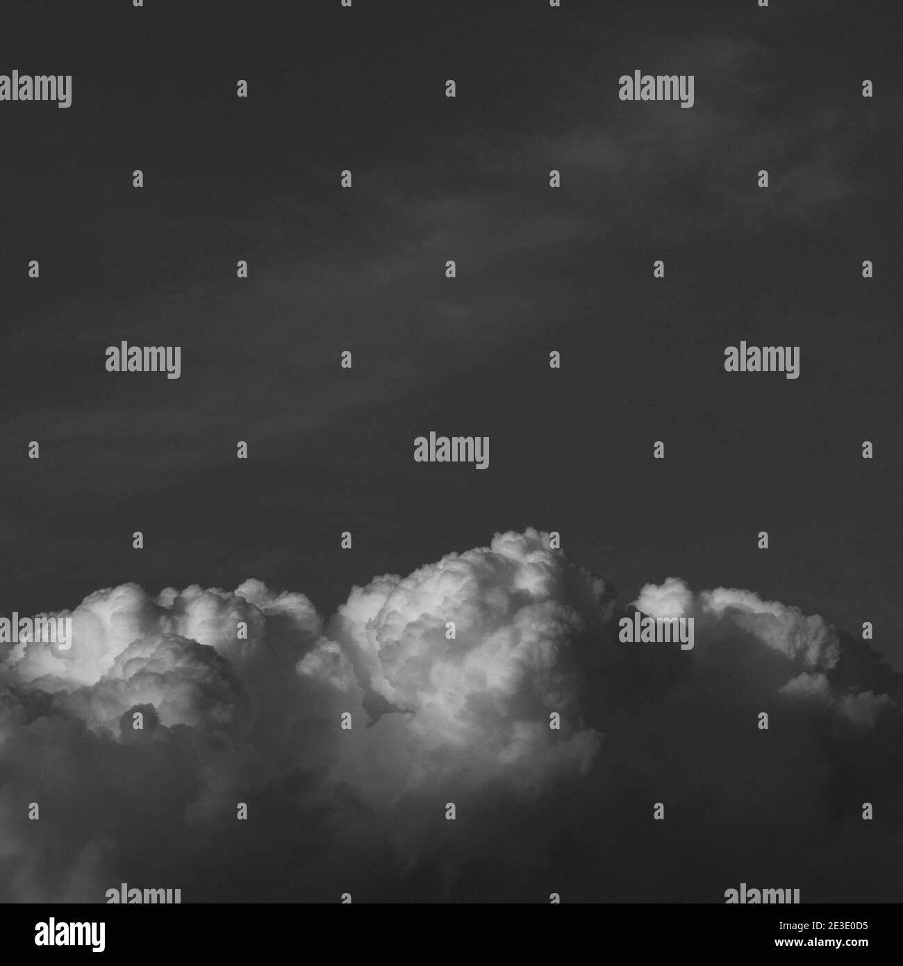 Dark blue sky fluffy white Black and White Stock Photos & Images - Alamy